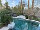 Backyard pool with rock features and lush landscaping around the perimeter at 4738 Laurel Canyon St, Las Vegas, NV 89129