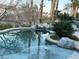 Sparkling pool with rock features and scenic backyard landscaping at 4738 Laurel Canyon St, Las Vegas, NV 89129