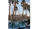 Sparkling backyard pool with palm trees and scenic reflections creates a relaxing oasis at 4738 Laurel Canyon St, Las Vegas, NV 89129