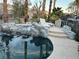 Inviting backyard pool featuring rock waterfall and lounge chairs at 4738 Laurel Canyon St, Las Vegas, NV 89129