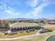 A sweeping aerial view showcases the community clubhouse with mountain views in the background at 4755 Rossini St, Pahrump, NV 89061
