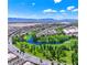 Expansive aerial view showcasing the community, golf course, water feature and mountain views in the distance at 4755 Rossini St, Pahrump, NV 89061