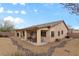 Large backyard with desert landscape, covered patio, and privacy walls offering relaxed outdoor living at 4755 Rossini St, Pahrump, NV 89061