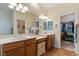 Spacious bathroom featuring double sinks, ample counter space, and a well-organized walk-in closet at 4755 Rossini St, Pahrump, NV 89061