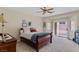 Comfortable bedroom featuring a queen-sized bed, sliding door access to the backyard, and a cozy atmosphere at 4755 Rossini St, Pahrump, NV 89061