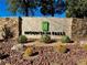 Stone community sign with desert landscaping and mountain views at 4755 Rossini St, Pahrump, NV 89061