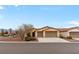 Charming single-story home with a three-car garage and desert landscaping at 4755 Rossini St, Pahrump, NV 89061