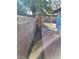 View of the side yard with a concrete block wall and brick pathway at 4795 Via San Andros, Las Vegas, NV 89103