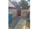 Backyard with a concrete block wall and access door at 4795 Via San Andros, Las Vegas, NV 89103