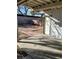 Backyard area with a covered patio and brick pathway at 4795 Via San Andros, Las Vegas, NV 89103