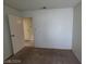 A bright bedroom features neutral carpeting and paint providing a blank canvas for personalization at 4795 Via San Andros, Las Vegas, NV 89103