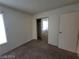 A cozy bedroom features neutral carpeting and includes a closet with mirrored doors at 4795 Via San Andros, Las Vegas, NV 89103