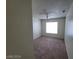 Well-lit carpeted bedroom with a ceiling fan and a window offering natural light at 4795 Via San Andros, Las Vegas, NV 89103
