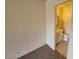 A carpeted bedroom with a view into an ensuite bathroom at 4795 Via San Andros, Las Vegas, NV 89103