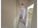 Functional hallway area that provides access to other rooms, tiled floors, and closet at 4795 Via San Andros, Las Vegas, NV 89103