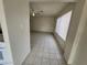 Open living area with neutral walls and tiled flooring for easy maintenance at 4795 Via San Andros, Las Vegas, NV 89103