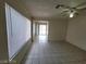 Bright living room with tile flooring and natural light from large window at 4795 Via San Andros, Las Vegas, NV 89103