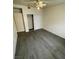 This cozy bedroom features hardwood floors and a closet for organized storage at 4928 E Monroe Ave, Las Vegas, NV 89110