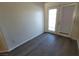 Cozy room with hardwood floors and a sliding glass door leading to the outside at 4928 E Monroe Ave, Las Vegas, NV 89110
