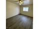 Bedroom features hardwood floors, a window, and neutral-colored walls, offering a bright and clean space at 4928 E Monroe Ave, Las Vegas, NV 89110