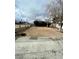 Spacious front yard ready for landscaping, with a concrete walkway and a low retaining wall at 4928 E Monroe Ave, Las Vegas, NV 89110