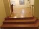 Entry stairs to a living area with ceramic tile and neutral colored walls at 4928 E Monroe Ave, Las Vegas, NV 89110