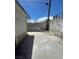 A partially concreted backyard with a block fence, offering a private and low-maintenance outdoor space at 5128 Forrest Hills Ln, Las Vegas, NV 89108