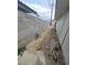 Backyard with a block fence and gravel landscaping, offering a private and low-maintenance outdoor space at 5128 Forrest Hills Ln, Las Vegas, NV 89108