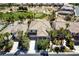 An aerial view captures a tile roof home next to a golf course with mature palm trees at 52 Cascade Lake St, Las Vegas, NV 89148