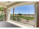 Balcony view overlooking a golf course, palm trees, blue sky, and scenic neighborhood at 52 Cascade Lake St, Las Vegas, NV 89148