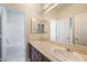 Bright bathroom features a double sink vanity, framed mirrors, and a separate tub at 52 Cascade Lake St, Las Vegas, NV 89148