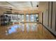 Fitness room showcasing glossy hardwood floors and wall of floor to ceiling windows at 52 Cascade Lake St, Las Vegas, NV 89148