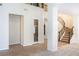 Open foyer with staircase and view into the living room and front door at 52 Cascade Lake St, Las Vegas, NV 89148