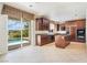 Elegant kitchen boasting custom cabinets, center island, and seamless access to the pool at 52 Cascade Lake St, Las Vegas, NV 89148