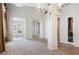 Bright living room with tile flooring, chandelier, and view of the front entryway at 52 Cascade Lake St, Las Vegas, NV 89148