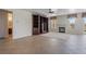 Bright living room featuring fireplace, built-in shelving and stylish tile flooring at 52 Cascade Lake St, Las Vegas, NV 89148