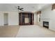 Cozy living area with tile flooring, fireplace, and built-in shelving with storage at 52 Cascade Lake St, Las Vegas, NV 89148