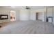 Open main bedroom featuring a fireplace, ceiling fan, and entry to another room at 52 Cascade Lake St, Las Vegas, NV 89148