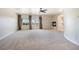 Spacious main bedroom with a ceiling fan, fireplace, and a balcony overlooking the outside at 52 Cascade Lake St, Las Vegas, NV 89148