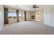 Large main bedroom features a ceiling fan, fireplace, and balcony with exterior views at 52 Cascade Lake St, Las Vegas, NV 89148