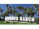 Rhodes Ranch sign with towering palm trees against a bright blue sky at 52 Cascade Lake St, Las Vegas, NV 89148