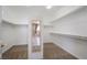 Walk-in closet with mirror and built-in shelving at 52 Cascade Lake St, Las Vegas, NV 89148