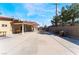 Large backyard with a covered patio, perfect for gatherings and outdoor activities at 5221 Holmby Ave, Las Vegas, NV 89146