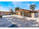 Expansive backyard with a covered patio, ideal for entertaining and enjoying the outdoors at 5221 Holmby Ave, Las Vegas, NV 89146