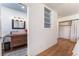 This bathroom features a modern sink and mirror, built-in shelves, and closet space at 5221 Holmby Ave, Las Vegas, NV 89146