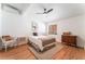 Cozy bedroom with hardwood floors, ceiling fan, and vintage furniture at 5221 Holmby Ave, Las Vegas, NV 89146