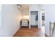 Bedroom with hardwood floors, vintage dresser, and closet with shelves and rod at 5221 Holmby Ave, Las Vegas, NV 89146