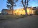 Charming exterior view of a single-story home with welcoming front porch at 5221 Holmby Ave, Las Vegas, NV 89146