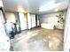 Spacious garage featuring ample storage, a white couch, and a bicycle hanging from the wall at 5221 Holmby Ave, Las Vegas, NV 89146