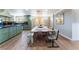 Spacious kitchen and dining area with custom cabinetry and modern countertops at 5221 Holmby Ave, Las Vegas, NV 89146
